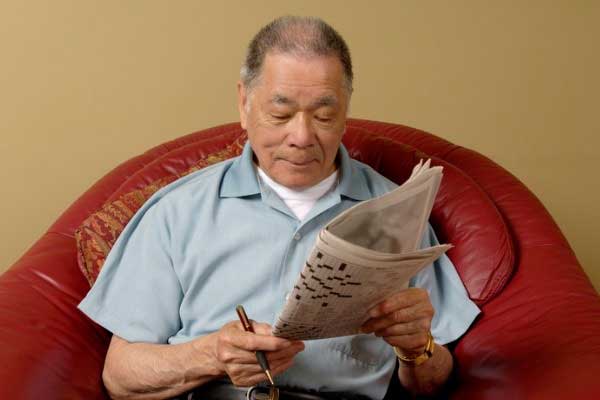 Man doing Crossword-puzzles