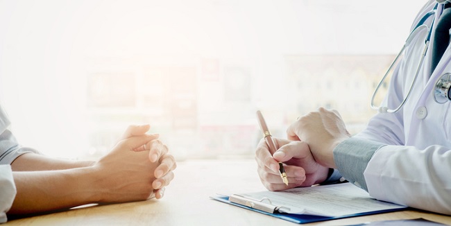 Doctors and patients sit and talk. At the table near the window in the hospital.Doctors and patients sit and talk. At the table near the window in the hospital. Doctors and patients sit and talk. At the table near the window in the hospital.