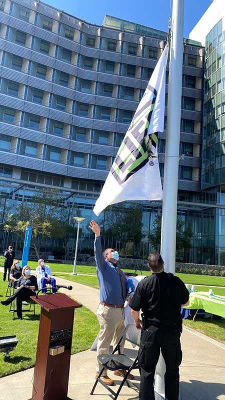 People Raising Flag